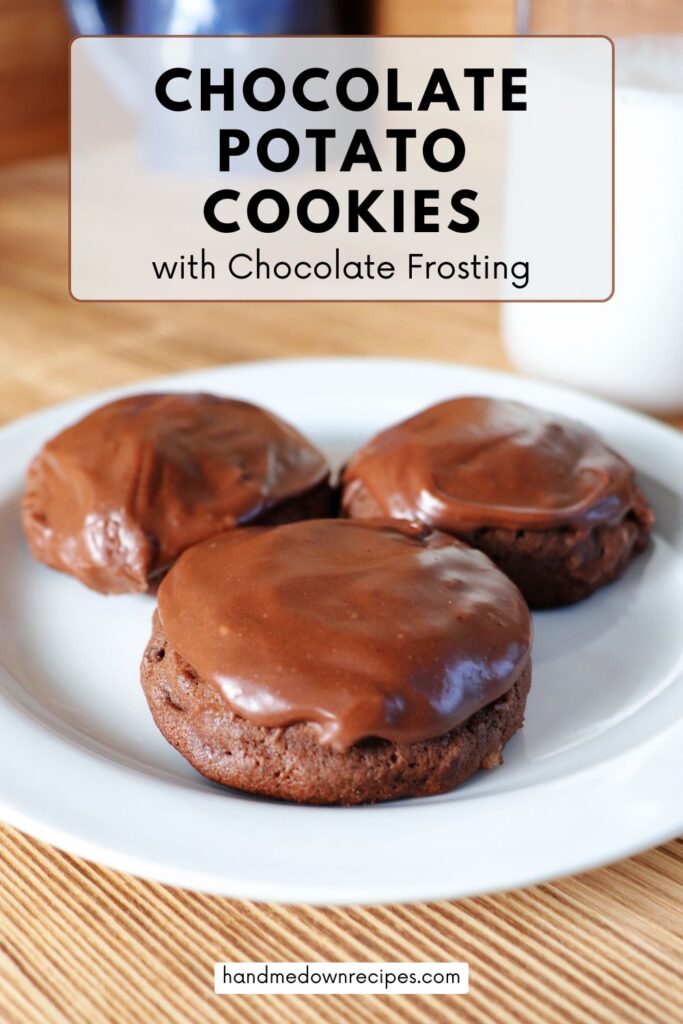 3 chocolate cookies with chocolate frosting sit on a plate with a glass of milk in the background. A text overlay box reads: Chocolate Potato Cookies with Chocolate Frosting.